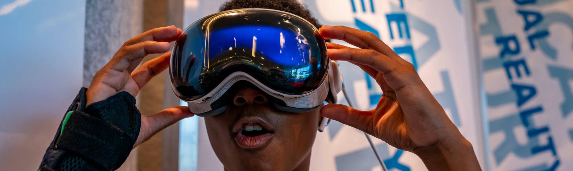 A student looking through a VR headset.